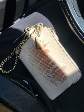 Coach Leather Wristlet in Blush and Gold Skyline Print × Jennifer Lopez